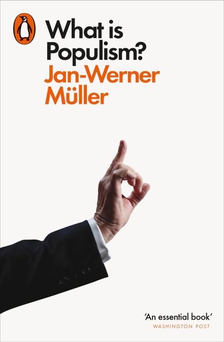 White background showing the arm of a white man wearing a black suit and white dress shirt, holding up one finger.